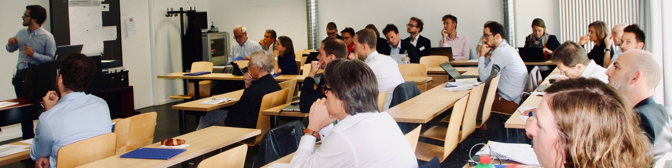 Participants listening to a presentation